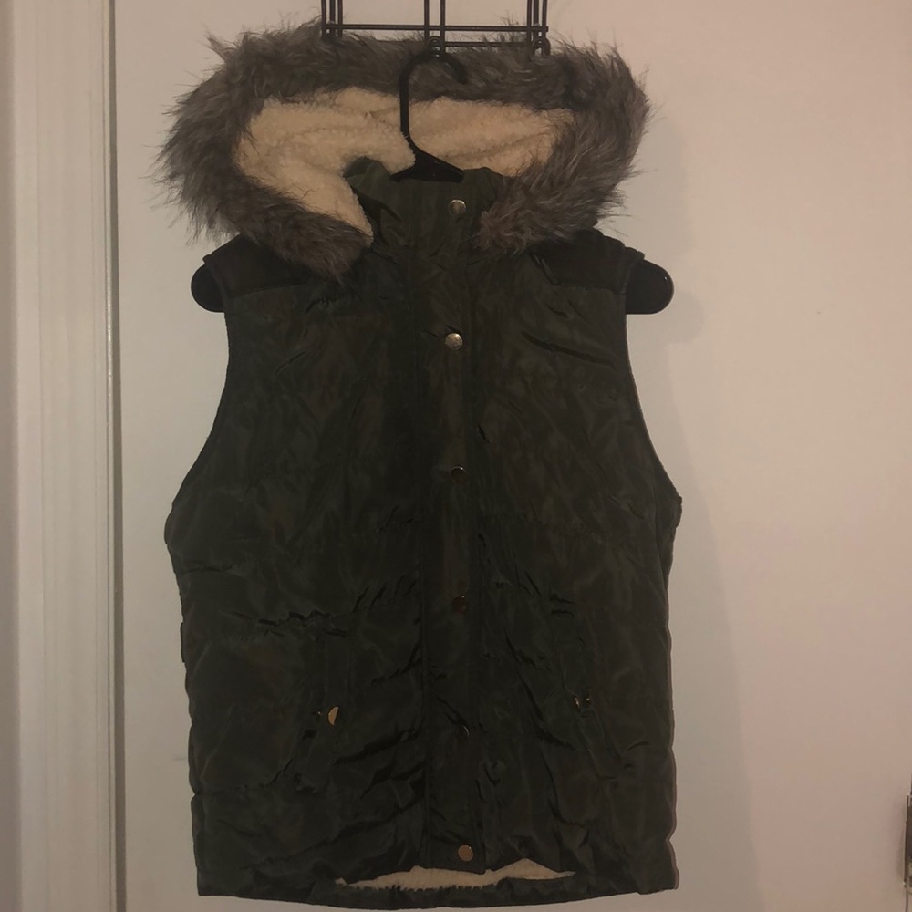 I am selling a dark/forest green vest with fur.